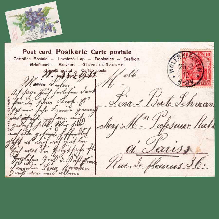 Rückseite einer alten Glückwunschkarte nach Paris mit Poststempel Wolfen und 10-Pfennig-Briefmarke Deutsches Reich.