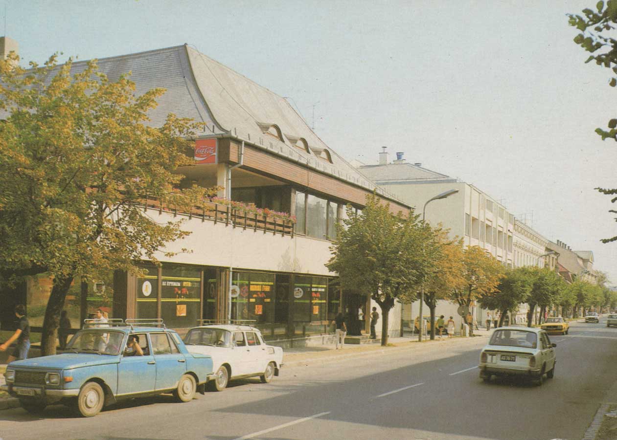 Old unsent postcard of Keszthely with restaurant, street view and historic cars
